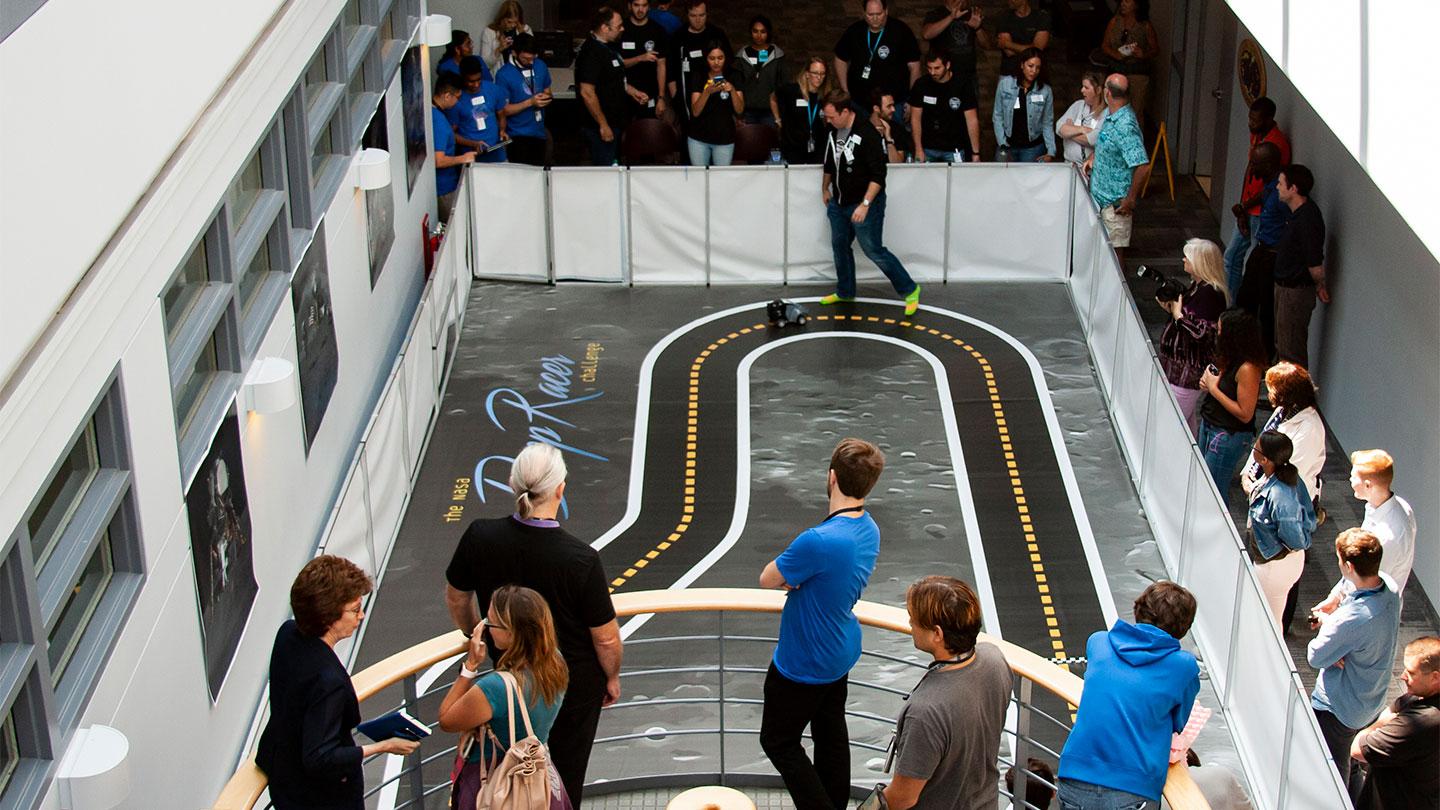 Onlookers watch the DeepRacer event that took place at NASA’s Goddard Space Flight Center. 