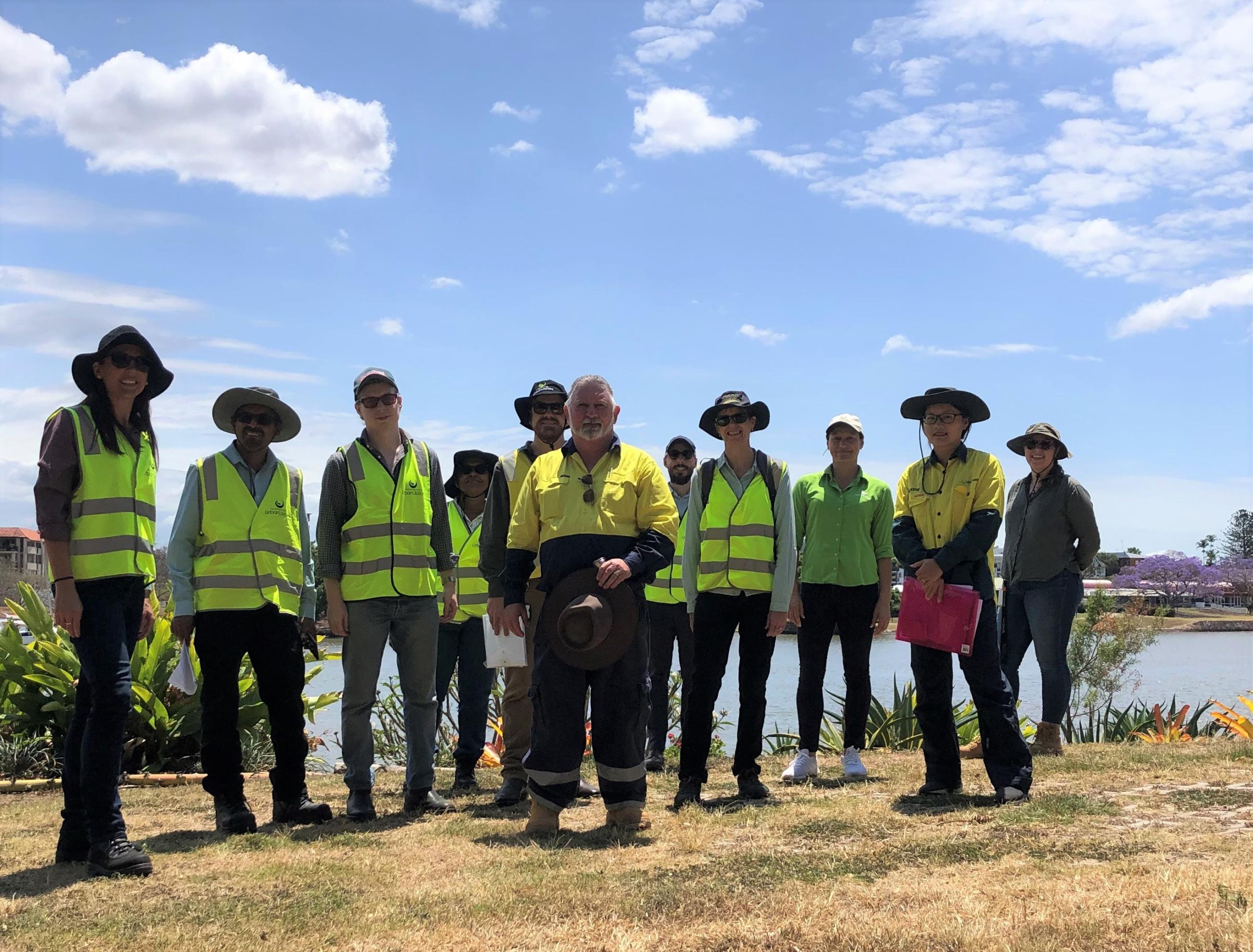 Urban Utilities team on site at Norman Bridge Reserve overlooking the Brisbane River with KBR team member Anita Parr 